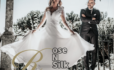"Image of a bride and groom on their wedding day, with the bride wearing a beautifully altered wedding dress by Rose N Silk."